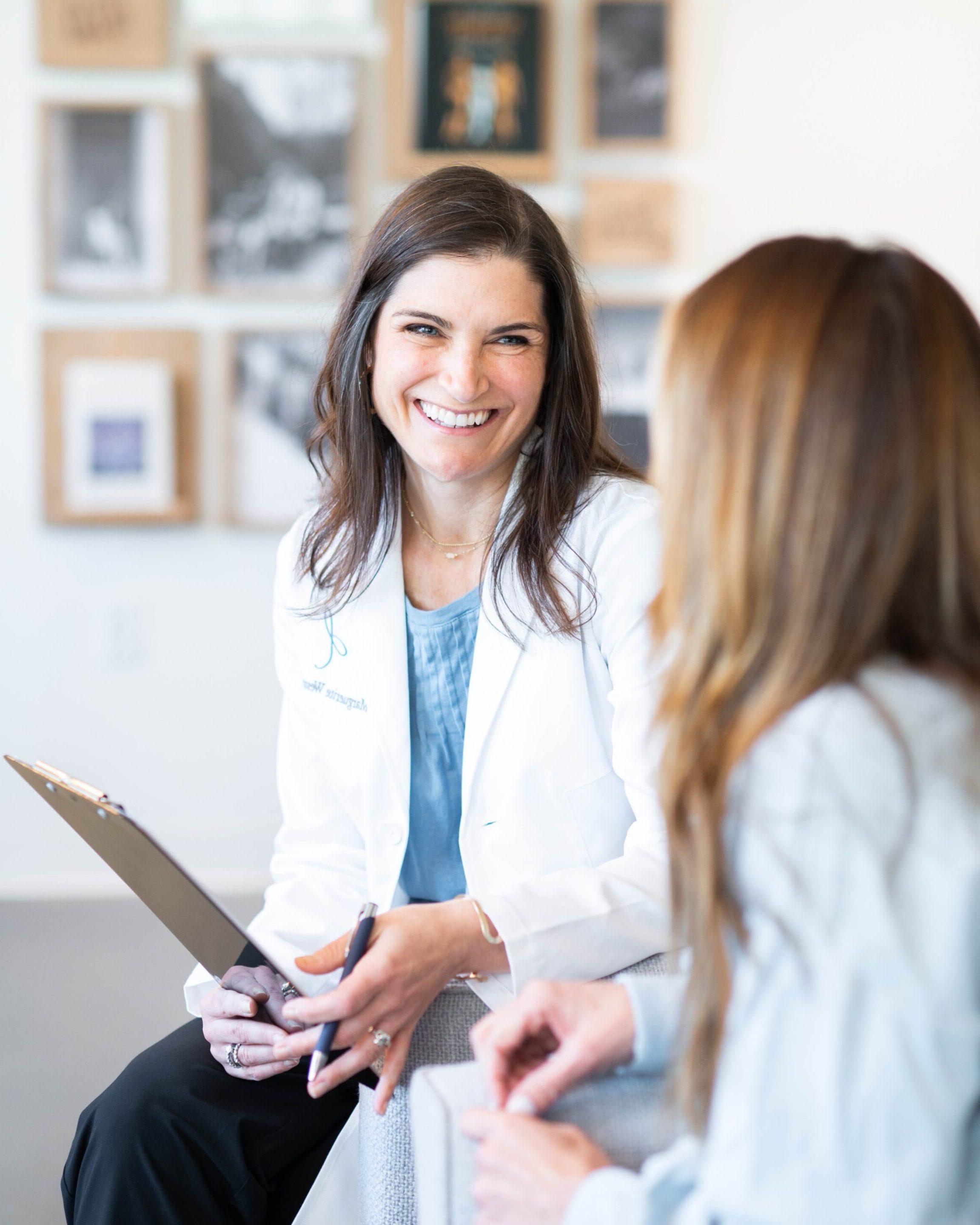 Dr. Weston discussing GI treatments with a patient